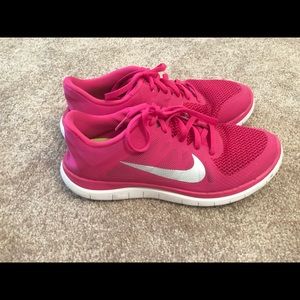 Pink and silver Nike Free 4.0